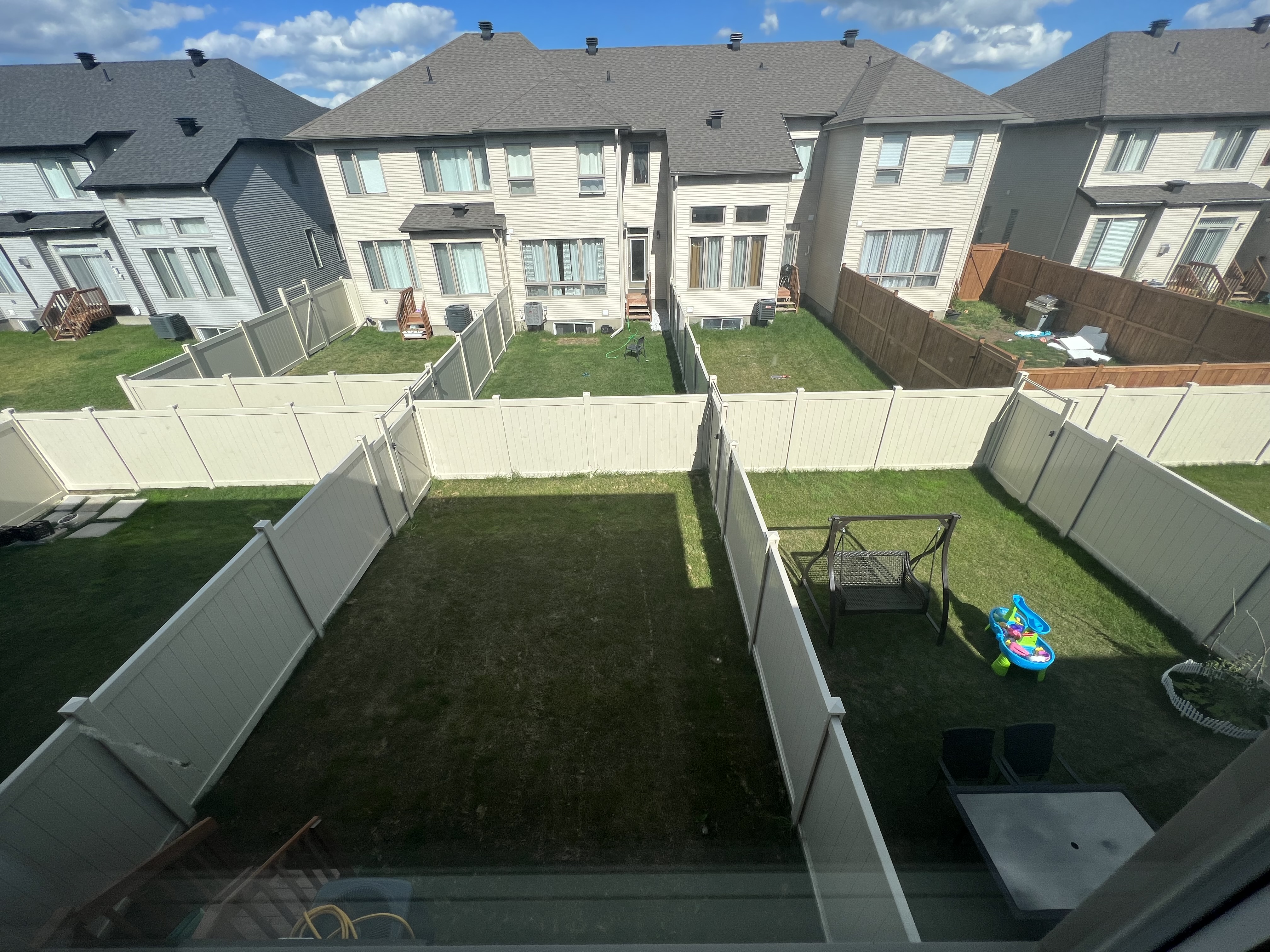 White PVC privacy fence installation in Ottawa backyard